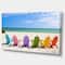 Designart - Adirondack Beach Chairs - Seashore Photo Canvas Art Print